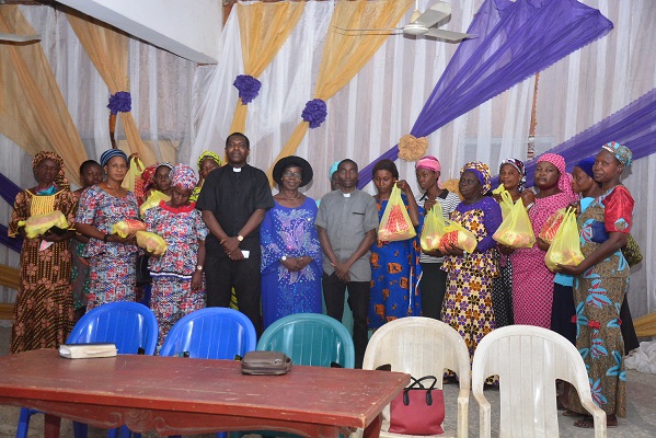 The visioneer, Chief Mrs Racheal  Olujohungbe (8 right) in the midst of clergymen and widows