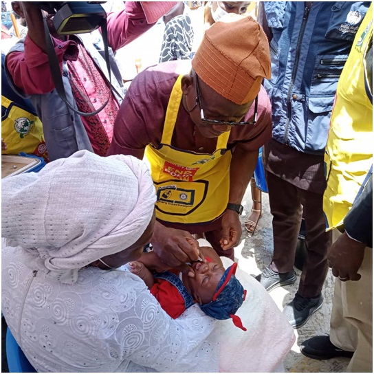 Permanent Secretary, Ondo State Primary Health Care Development Agency,(OSPHCDA), Dr. Francis Akanbiemu immunising a child, Zion Ogundahunsi, at the Arakale Comprehensive Health Centre, Akure in  commemoration of the African Vaccination Week, while his grandmother, Toying Ajayi watches yesterday

Photo: Kemi Olatunde