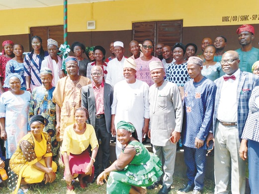 Ondo SUBEB Chairman, Victor Olabimtan in the middle (White) with staff of AUD Grammar School, Akungba Akoko and other government officials