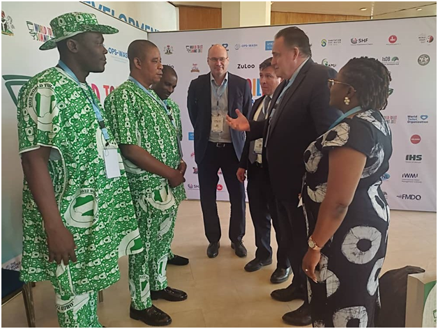 Rt. Hon. Olotu Fatai commissioner for water Resources, Public Sanitation and Hygiene , Alh. Olabode Yusufu , PS of water Resources and Engr. Oluwarotimi Oladimeji, General Manager RUWASSA discussing with Donor Partners at World Toilet Summit in Abuja