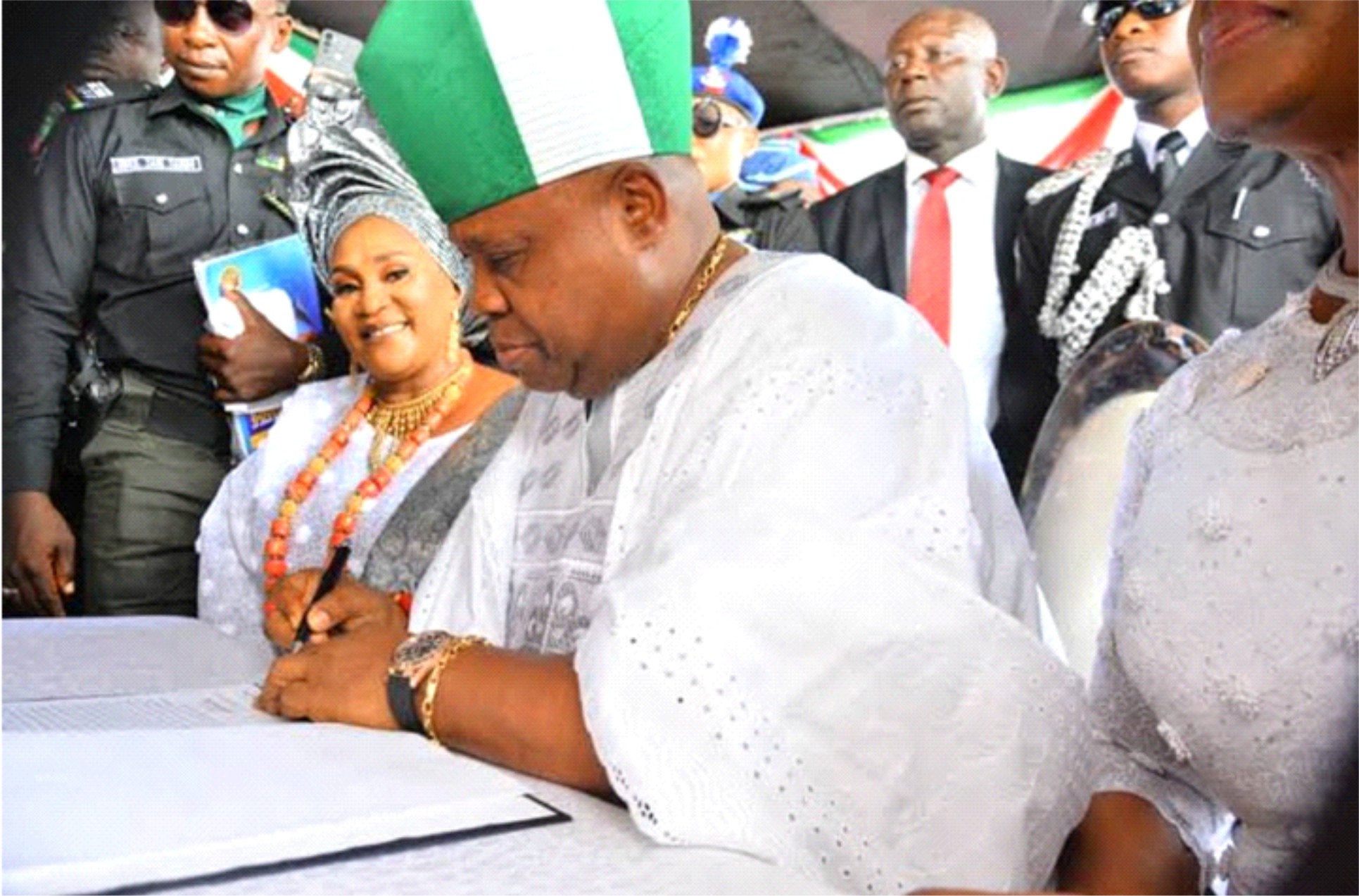 Senator Ademola Adeleke signing his oath of office as new Governor of Osun State, yesterday