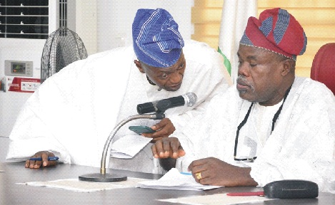 From left: Deputy Speaker, Ondo State House of Assembly, Mr Samuel Aderoboye, discussing with Speaker, Mr Bamidele Oleyelogun, at a plenary held at the Assembly Complex in Akure                            Photo: Peter Oluwadare