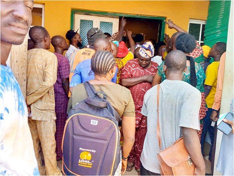 Registered voters on queue for collection of PVCs at INEC office in Akure South Local Government
Photo: Stephen Olajide