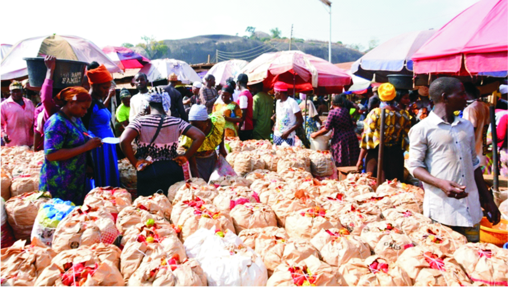 Residents buying food items at Shasha market…yesterday       Photo: Ayodele Suberu