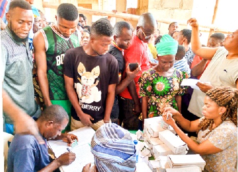 Eligible voters at Ward 5, Amudipe quarters in Akure, collecting their Permanent Voters Cards (PVCs) to partake in the forthcoming general elections                                                             Photo: Stephen Olajide