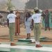 NYSC Ondo State Coordinator, Mrs. Victoria Nnenna Ani taking salute from the Quarter Guard mounted in honour of NYSC DG during 2023 Batch 'A' (Stream 1) orientation course closing ceremony in Ikare-Akoko