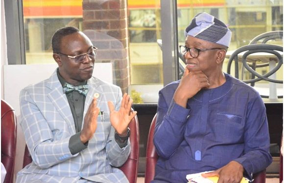 Ondo State Head of Service, Pastor Kayode Ogundele discussing with the Special Adviser to Governor on Union Matters and Special duties, Mr Dare Aragbaiye during the Inauguration of governing council held at Cocoa conference Hall governor's office Akure.... Yesterday