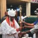 From left: The Amanana-Owei of Biagbini Clan in Ese-Odo Local Government, Oba  Pere Moses Igeiyobaghi Uguoji, receiving his Staff of Office, from Commissioner for Local Government and Chieftaincy Affairs, Alhaji Amidu Takuro at the ceremony