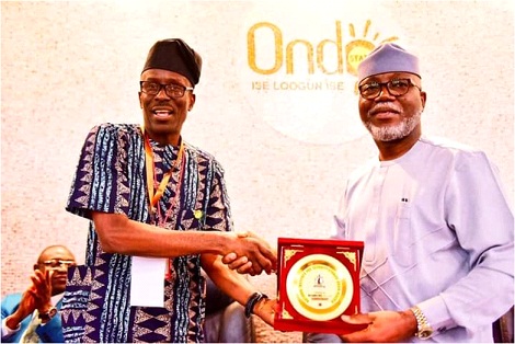 From left: Leader of the Team, Mr Bartholomew Omoaka, presenting a souvenir to Ondo State Deputy Governor, Mr Lucky Aiyedatiwa at the event