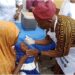 Permanent Secretary, Ondo State Primary Health Care Development Agency, Dr Francis Akanbiemu  who represented Commissioner for Health, Dr Banji Ajaka , administering a dose of the vaccine on a child at the event                                                               Photo: Kemi Olatunde