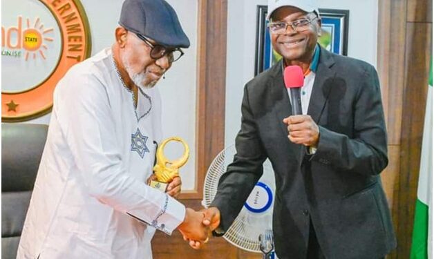 From left: Ondo State Governor, Arakunrin Oluwarotimi Akeredolu received Merit award of the Nigeria Institution of Estate Surveyors and Valuers (NIESV)  been presented by Commissioner for Education Sciences and Technology, Pastor Femi Agagu during the State Executive meeting held at Governor's office in Akure