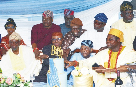 Front row: From left: Afenifere Chieftain, Basorun Seinde Arogbofa, former Ondo State Governor, Dr Olusegun Mimiko, Afenifere National Leader, Pa Reuben Fasoranti, Oluresi of Iresi, Oba Olajide David and other dignitaries at the cutting of the cake to celebrate Pa Fasoranti's 97th birthday at his residence in Akure …yesterday