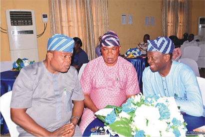 From left: Chairman, Akoko South-West Local Government, Mr Augustine Oloruntogbe, discusiing with his counterparts  for Ondo West Local Government, Mr Ebenezer Akinsulire and  Owo Local Government, Mr Samuel Adegbegi, at a stakeholders' meeting on the implementation of Metro Fibre network across Ondo State, held at SITA Hall in Akure Photo: Ayodele Suberu