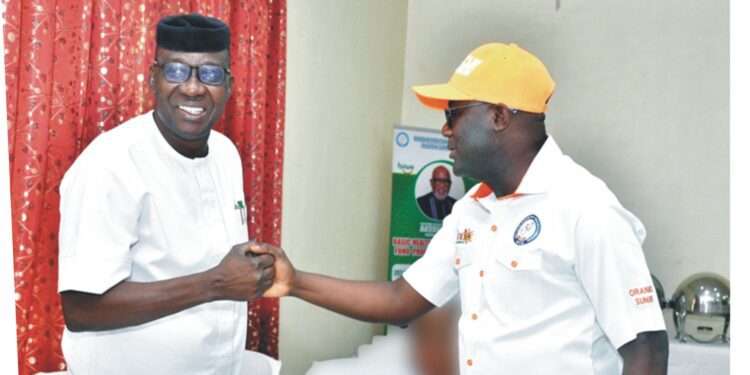 From left: Ondo State Commissioner for Health, Dr. Banji Awolowo Ajaka, exchanging pleasantries with Director-General of the State Contributory Health Commission, Dr. Abiodun Oyeneyin at a stakeholders' sensitisation programme on Orange Health Insurance Scheme (ORANGHIS) in Akure, yesterday                                                                               Photo: Kemi Olatunde