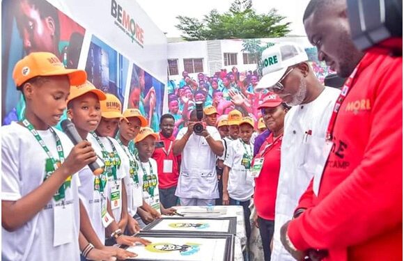 Ondo State Acting Governor, Mr Lucky Aiyedatiwa (2ndR), inspecting some drawings by the BEMORE girls, during the closing ceremony of the 2023 Summer Boot Camp held in Akure