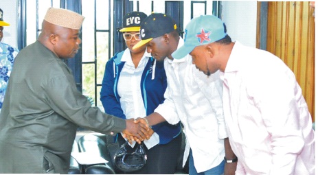The ODHA Speaker,Mr.Oladiji Olamide (L) exchanging pleasantries with members and the leader of the Ekimogun Youth Connect, Mr. Lucas Famakinwa, during their visit to the Speaker's office in Akure